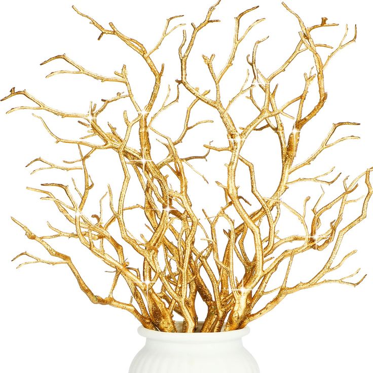 a white vase with gold branches in it