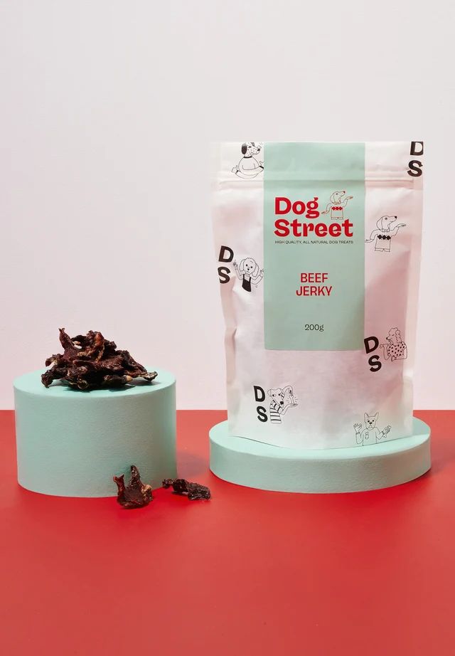 A pack of Dog Street's Beef Jerky, with some of the chicken beef jerky on display next to it Dog Treats Product Photography, Dog Treat Photography, Pet Food Branding, Liver Curry Recipe, Liver Fry Recipe, Dog Product Photography, Liver Fry, Dog Packaging, Dog Treat Packaging