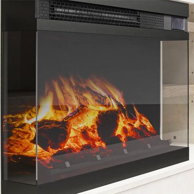 a fire burning inside of a glass fireplace