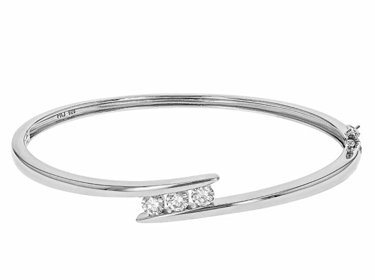 Moissanite Fire® .99ctw diamond equivalent weight round, Platineve® bangle bracelet. Measures approximately 7 & 1/4" L x 5/16" W and has a box clasp with stainless steel tongue. Actual moissanite weight is .87ctw. Modern Channel Set Diamond Bracelet For Anniversary, Fine Jewelry Diamond Bracelets With Channel Set, Diamond White Channel Set Diamond Bracelet, Fine Jewelry Diamond White Diamond Bracelet With Channel Set, Fine Jewelry Diamond Bracelet With Channel Set, Channel Set Diamond Bracelet In Fine Jewelry Style, Modern White Gold Diamond Bracelet Channel Set, Channel Set Diamond Bangle Bracelet, Modern Channel Set Diamond Bracelet In White Gold