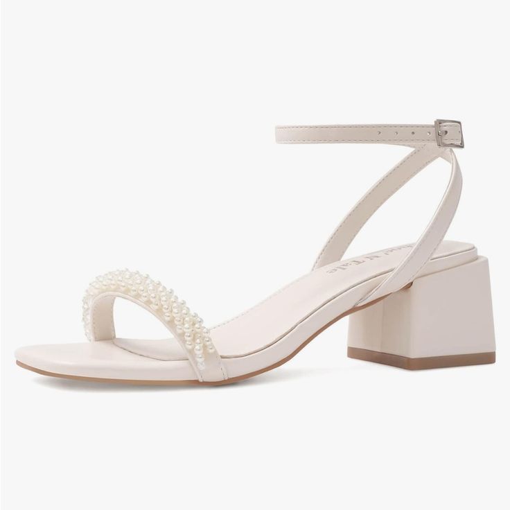 a women's white high heeled sandal with pearls