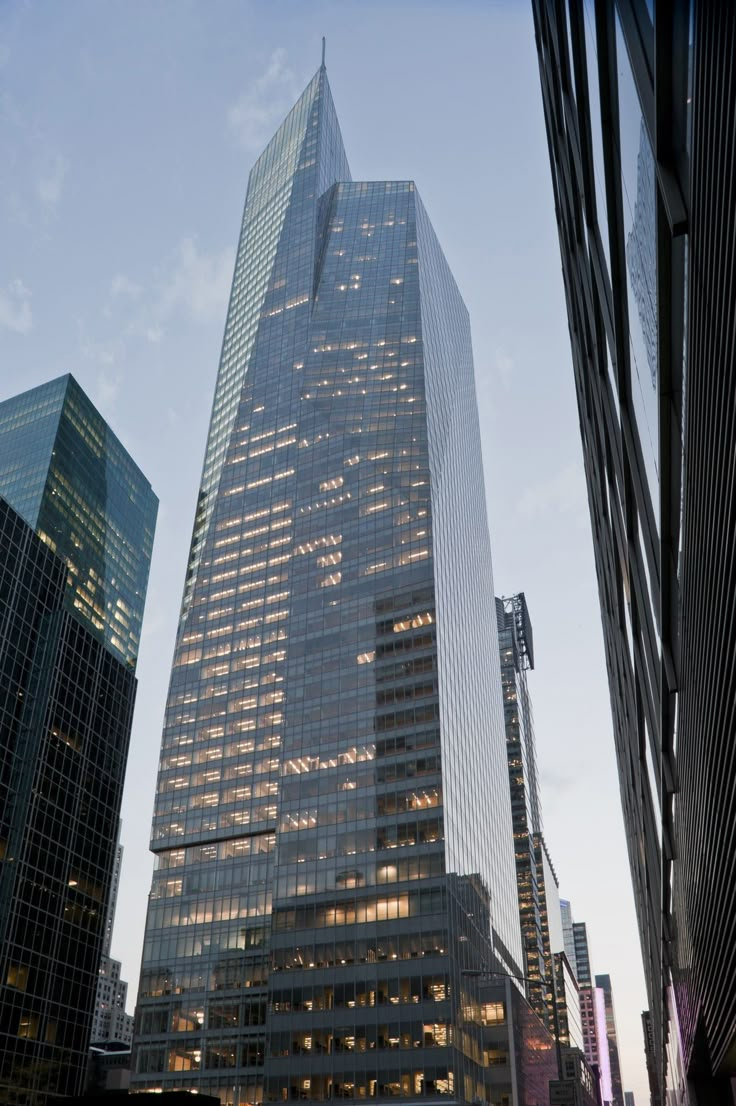 the skyscrapers are all lit up at night