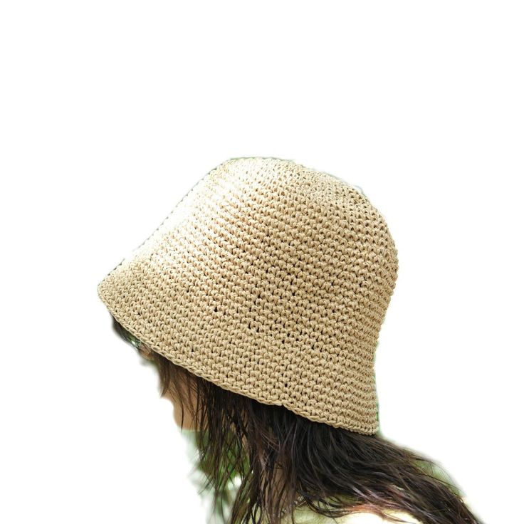 This hat is handmade and crafted from raffia yarn. Raffia yarn is a natural and durable material, ensuring the hat's longevity. The beige color and simple design make it an ideal accessory for both everyday use and outdoor activities like the beach. The wide-brim bucket shape provides sun protection and offers a stylish look. Its comfortable and lightweight structure ensures easy and prolonged wear. Raffia. You can store this hat, knitted from raffia rope, in a breathable cloth bag, protect it from fire and heat, and wipe the stains with a clean damp cloth. Natural Wide Brim Toquilla Straw Bucket Hat, Natural Straw Bucket Hat With Flat Brim, Beige Woven Straw Hat With Curved Brim, Natural Lightweight Wide Brim Crochet Hat, Lightweight Straw Hat In Natural Color, Beige Toquilla Straw Bucket Hat With Flat Brim, Natural Toquilla Straw Bucket Hat With Flat Brim, Beige Wide Brim Bucket Hat In Toquilla Straw, Beige Wide Brim Toquilla Straw Bucket Hat