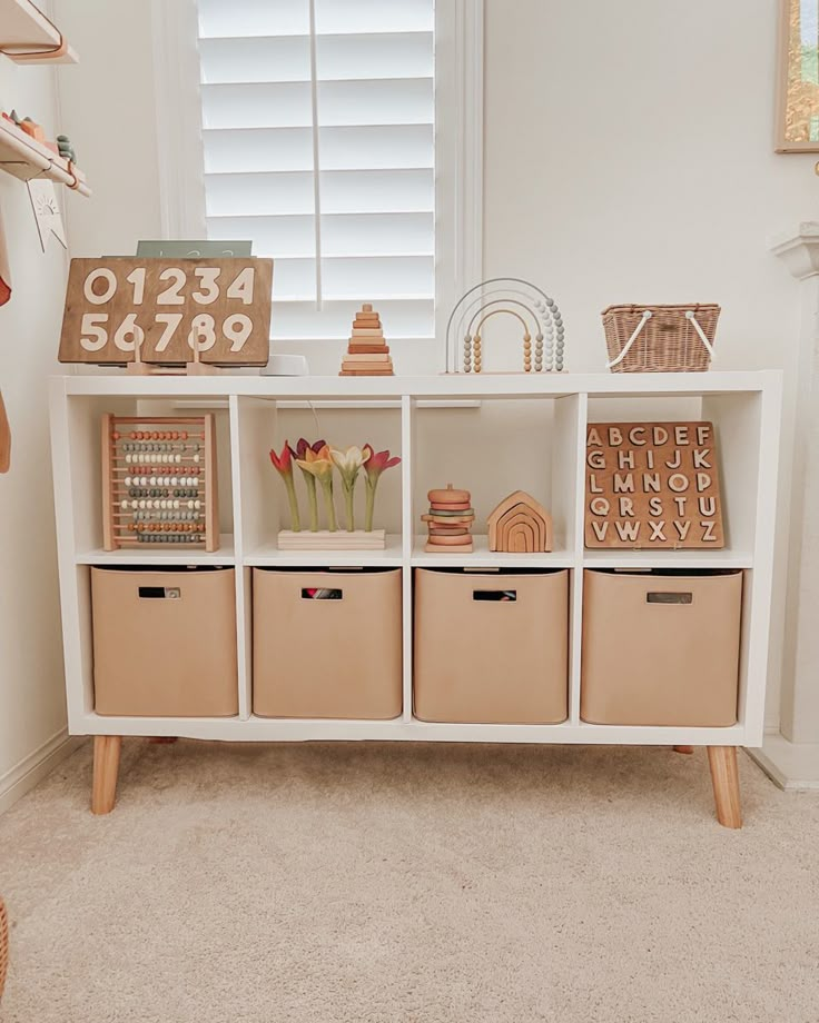 1. Kallax ikea shelf 
2. Amazon mid century legs 
3. Gathre medium sized bins Nursery Room Inspiration, Kid Toy Storage, Toy Room, Nursery Baby Room, Playroom Ideas, Ikea Diy, Ikea Kitchen, Kid Room, Baby Girl Nursery