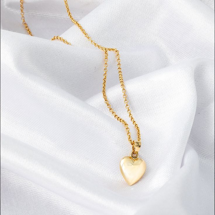 Perfect as a Valentine's gift or a heartfelt present for someone special, this love pendant is sure to make a lasting impression. Wear it alone for a subtle statement or layer it with other favorites for a trendy look. Show your love and appreciation with this beautiful 14k gold 3D heart necklace. *Free Express International Shipping *Free returns within 14 days from the order date. *14K solid gold chain is included if you select. NEXT BUSINESS DAY SHIPPING! PRODUCT DETAILS *The product is made of 100% 14k Solid Gold and it has a 14K or 585 stamp on item. (We don't sell filled or plated jewelry) *The package includes a gold certificate.  *The product includes 14K solid gold chain. *Every package comes in a gift box. *14K gold indicates that the product is produced from 58% pure gold. *Chai 14k Gold Heart Pendant Necklace With Adjustable Chain, Delicate Yellow Gold Heart Pendant Necklace, Delicate Yellow Gold Heart Pendant Charm Necklace, 14k Gold Heart Pendant Locket For Anniversary, Delicate Yellow Gold Heart Necklace With Round Pendant, Dainty Yellow Gold Heart Necklace With Charm, Elegant Gold Heart Necklace For Keepsake, Yellow Gold Heart Cut Necklace With Delicate Chain, Elegant Gold Heart Keepsake Necklace