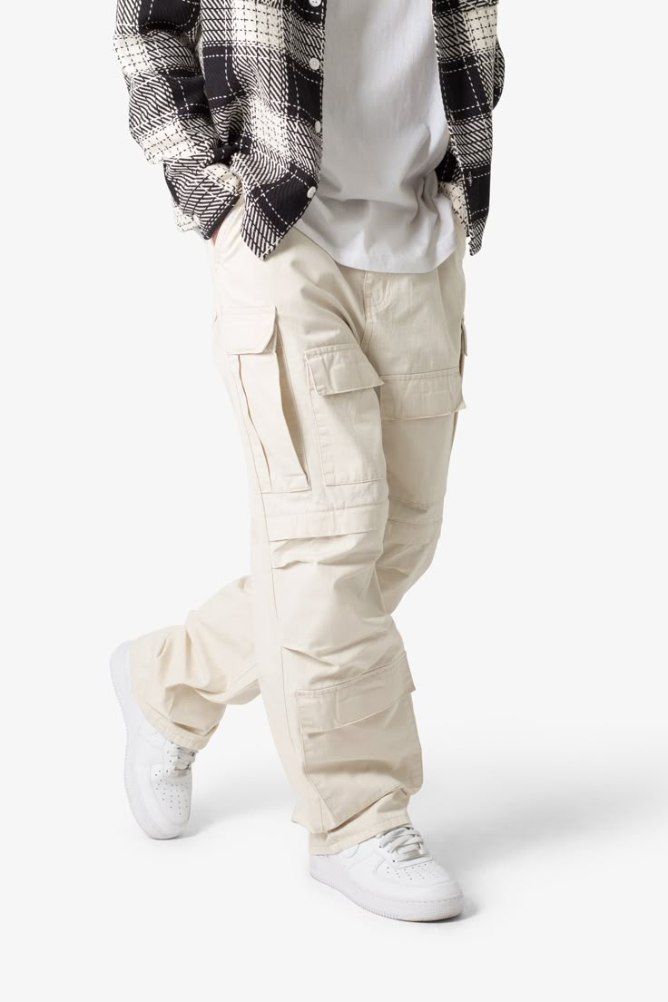 the Ultra Baggy Cargo Pants are designed with a new oversized ultra baggy fit, constructed from a ripstop fabric with a rinse wash, featuring cargo pockets throughout with snap closures, and finished with a button placket. details ultra baggy fit throughout 100% cotton extended inseam model is 6’1, 140 lbs and wears a size 30 Mens White Cargo Pants Outfit, Kargo Styles Man, Nyc Winter Fashion Men, Best Cargo Pants For Men, Mens Streetwear Pants, Gen Z Streetwear, Mens Clothing Styles Baggy, White Baggy Pants Outfit Men, Mens Clothing Styles Casual Pants