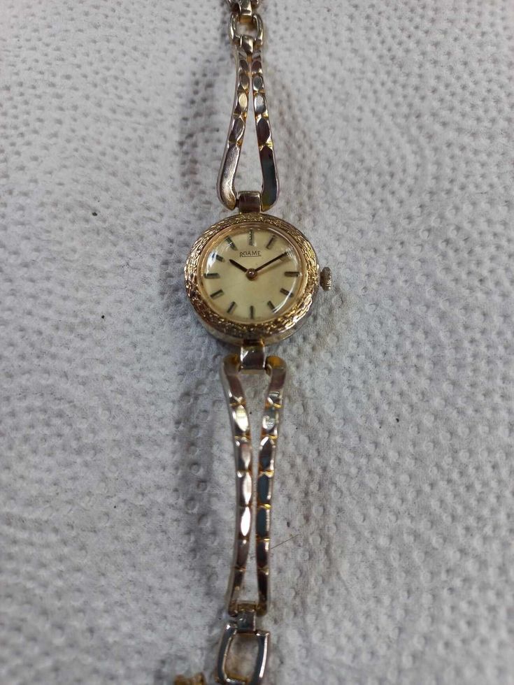 Doxa Swiss woman mechanical bracelet watch Golden coloured dial with golden and black markers and hands Dimensions in mm : width/length/thickness 27/28/8 NEW Crystal 17 jewels Swiss Doxa movement Stainless Steel gold plated case. Original steel bracelet strap Gold Diamond Watch With Metal Dial For Evening, Formal Metal Watches With Round Dial, Formal Metal Watch With Round Dial, Formal Metal Diamond Watch With Round Dial, Yellow Gold Metal Watch With Metal Dial, Gold Metal Jewelry And Watches With Round Dial, Gold Metal Watches For Anniversary, Formal Diamond Watch With Round Dial, Formal Metal Watches