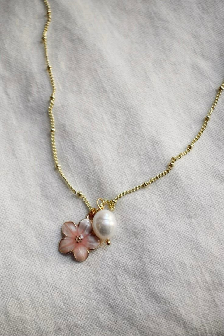 This dainty Charm Necklace is perfect for a girly girl on vacay! Available in 3 color variations. European Jewelry Trends, Necklace Stack Inspo Gold, Chic Summer Jewelry With Flower Charm, Handmade Flower-shaped Chic Jewelry, Rose Gold Flower Jewelry For Summer, Summer Rose Gold Flower Jewelry, Delicate Flower Jewelry For Summer, Rose Gold Flower Necklace For Spring, Delicate Flower Shaped Summer Jewelry