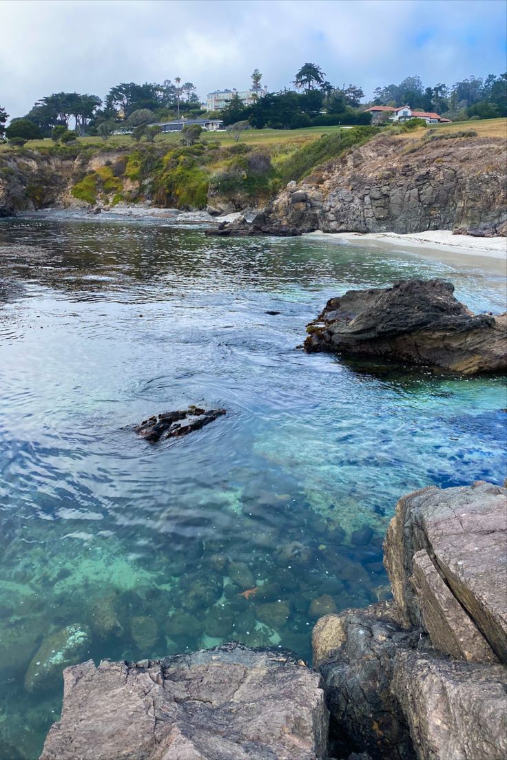 a body of water surrounded by large rocks