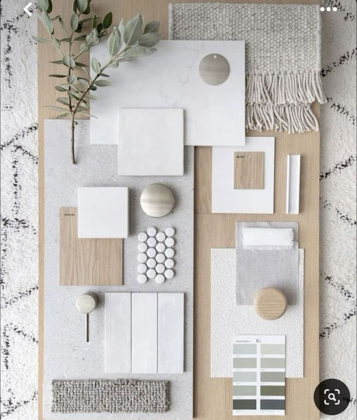 an overhead view of a living room with neutral colors and white accessories on the floor