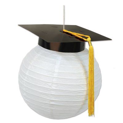 a graduation cap and tassel on top of a white paper lantern ornament