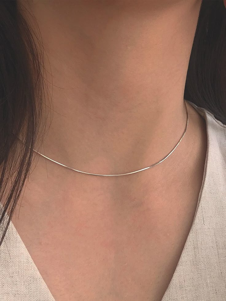 Editor's Notesbyweekend presents an essential snake chain necklace with silky smooth gloss. It is a simple yet, feminine item that stands out. - Snake chain- Silky smooth gloss- Made of silver 925- 18K gold plated- Sleek silhouette- Simple and basic style Measurements(in.)One Size- Size: 14.96 in. ( + 1.97 in. ) Composition & Care- Material: Silver 925, 18K Gold Plating- Plated products may discolor over time due to their nature.- Please be careful that discoloration may proceed faster in chemical substances, water, and heat.- As all jewelry products are vulnerable to discoloration, we recommend you gently wipe them with a dry cloth and store them in an airtight zipper bag when not wearing them Designer- by byweekend Daily Wear Neck Chain, Simple Chain Necklace Silver, Short Chain Necklace, Ring Chain Necklace, Stackable Necklaces Silver, Minimal Silver Necklace, Small Silver Jewelry, Classic Herringbone Snake Chain Necklace, Minimalist Silver Snake Chain Necklace