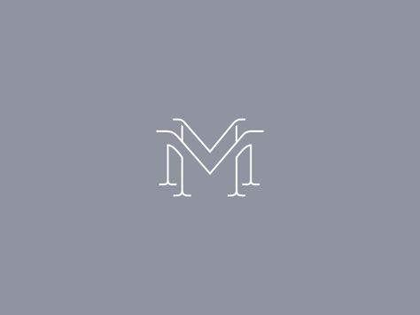 the letter m in white on a gray background