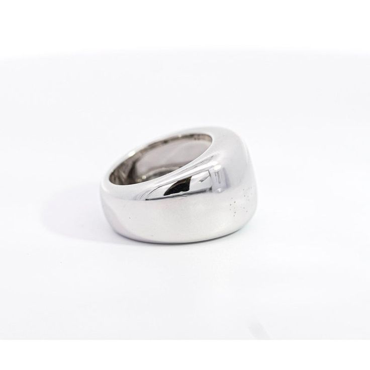 Vintage Cartier Nouvelle Vague Ring, set in 18K White Gold.   This unisex dome ring showcases a remarkable display of gleaming silver/white hues. An authentic vintage creation from Cartier, it embodies the brand's rich legacy of quality and craftsmanship. Made in 1997.  Item Details: - Type: Vintage  - Cartier Nouvelle Ring  - Serial No.: H16257** - Date: 1997 - Metal: 18K White Gold  - Weight: 14.3 Grams  - Size: 5  - Measurements: 13.5 MM   _______________________________  Please refer to the Luxury Dome Ring With Shiny Finish, Luxury Open Dome Ring With Polished Finish, Luxury Shiny Finish Signet Ring For Formal Occasions, Luxury Signet Ring With Shiny Finish For Formal Occasions, Luxury Polished Open Signet Ring, Luxury Jewelry Ring With Shiny Finish, Classic Jewelry With Polished Finish And Wide Band, Classic Wide Band Jewelry With Polished Finish, Timeless Formal Rings With Thick Band