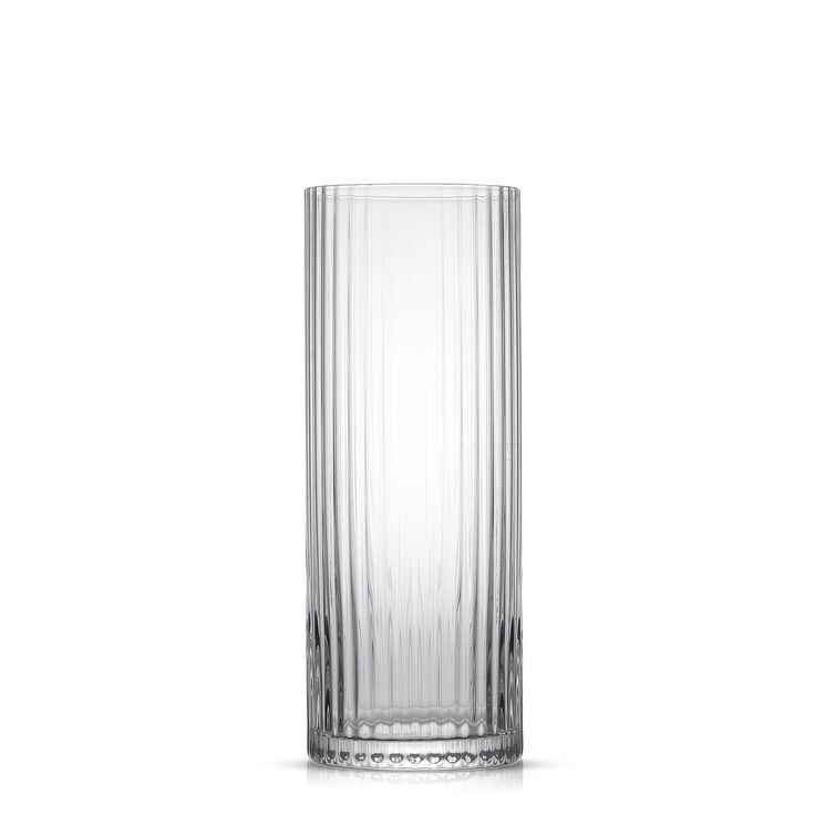 a tall glass vase sitting on top of a white table