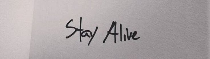 the word stay alive written in black ink on a white paper