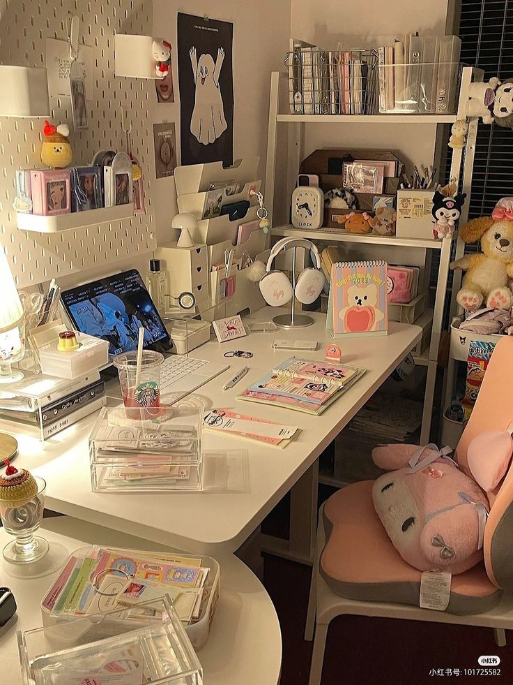 a desk with many items on it in a room