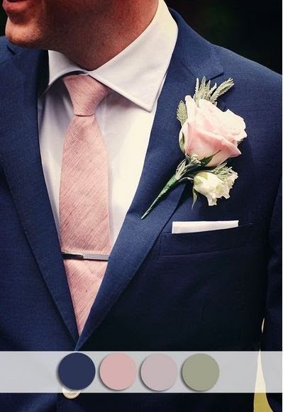 a man wearing a suit and tie with a pink rose on it's lapel