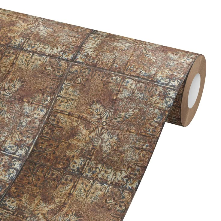 a roll of brown and tan colored carpeting on top of a white background with an intricate pattern