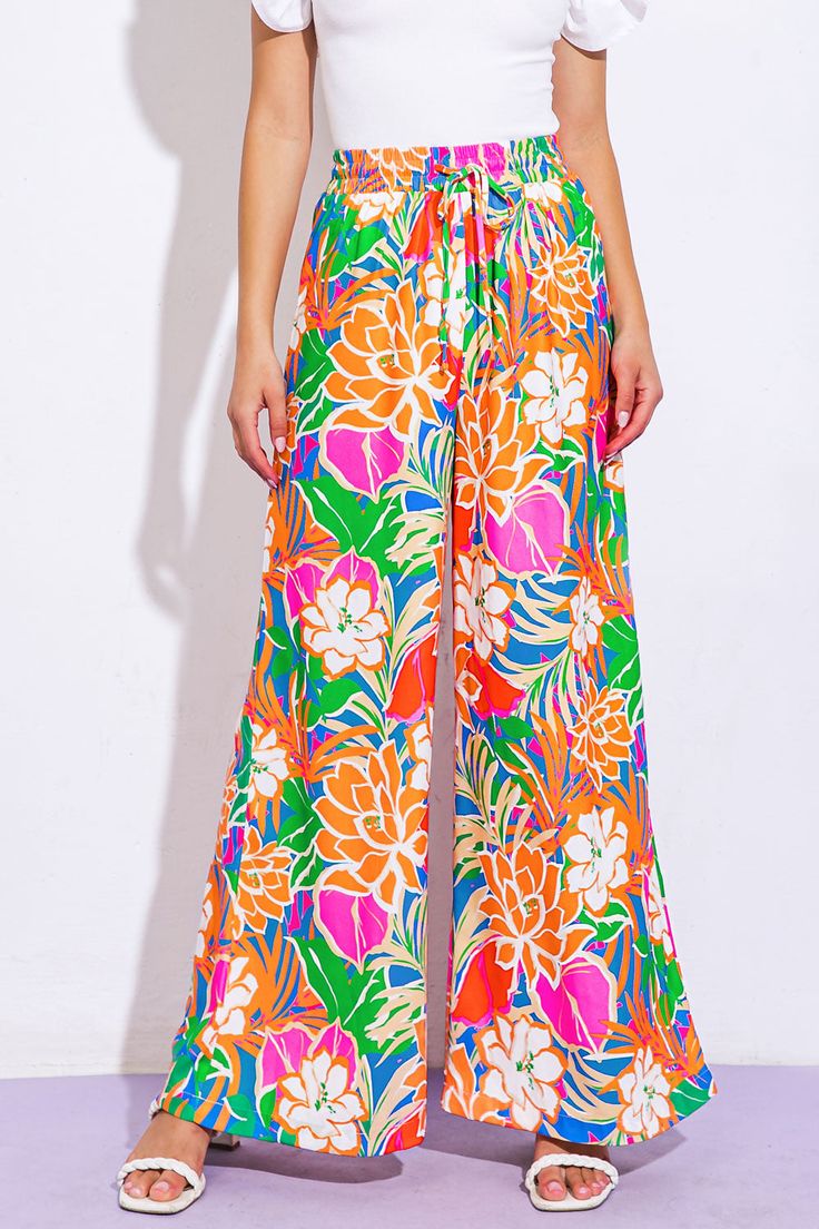 A printed woven pant featuring elasticized waist, front tie and wide leg. Matching top IT13075Details:Self : 100% PolyesterSize & Fit- Model is 5`8" And Wearing Size Small- Measurements Taken From Size Small- Approx. Length: 42" Spring Vacation Wide Leg Rayon Pants, Spring Vacation Rayon Wide Leg Pants, Spring Vacation Rayon Pants, Floral Print Wide Leg Pants For Vacation In Spring, Floral Wide Leg Pants For Vacation In Spring, Floral Print Wide Leg Pants For Spring Vacation, Summer Rayon Wide Leg Pants, Summer Floral Print Wide-leg Pants, Floral Print Wide-leg Pants For Vacation