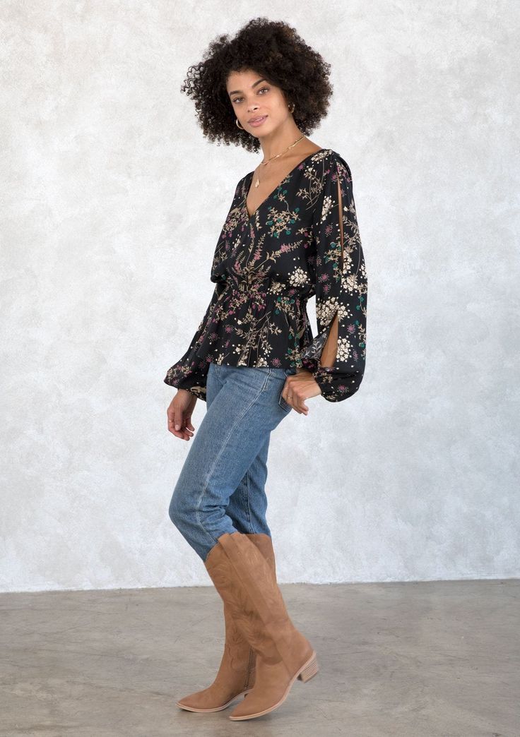 With bohemian details throughout, this flattering peplum blouse is a go-to style for the season. Designed in an autumnal wildflower print, featuring long voluminous split sleeves, a sexy open back with tassel tie closure, and a v-neckline. FINAL SALE Wildflower print Relaxed fit Long voluminous split sleeve Elastic wrist cuff Elastic peplum waist V-neckline Open back with tassel tie closure Dreamy bohemian blouse Model is 5'8, wearing a size S.Style: I-13716W-ROR-CD Bohemian Blouse, Black Jade, Split Sleeve, Bohemian Blouses, Blouse Models, Peplum Blouse, Wrist Cuffs, Peplum Top, Open Back