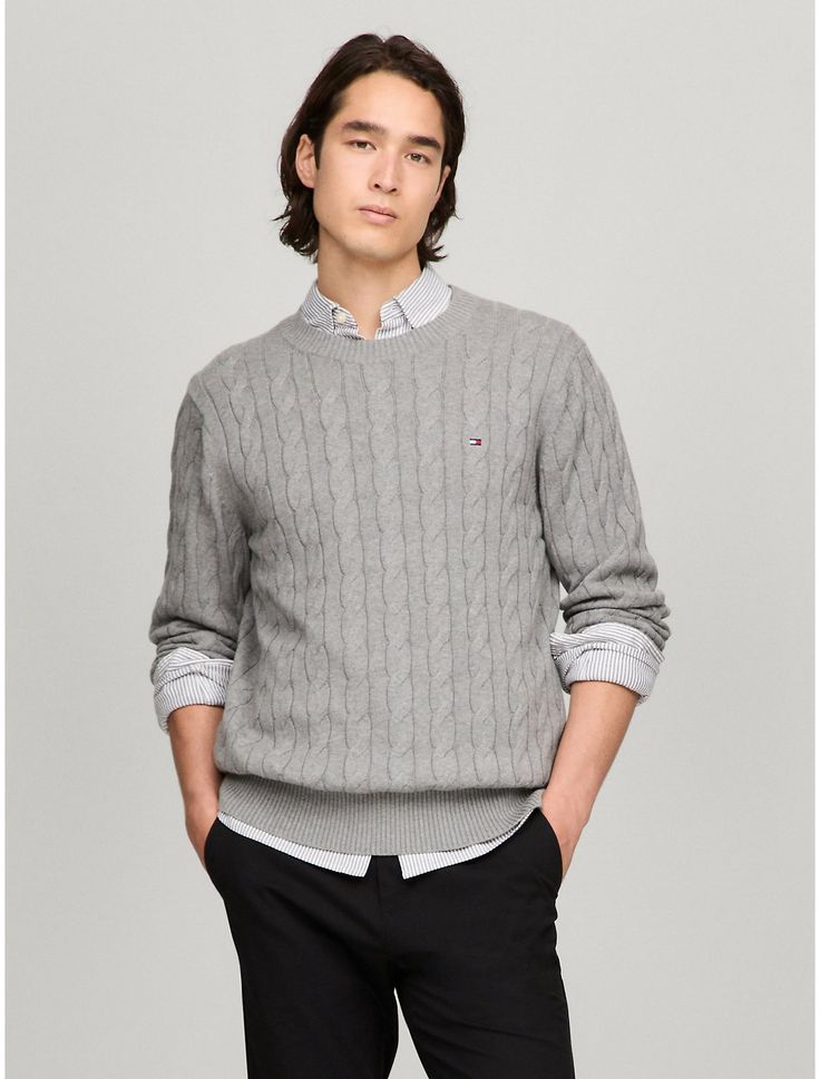 Tommy Hilfiger men's sweater. Made from soft cotton in a textured cable knit weave, this crewneck sweater is the perfect layer, complete with rib-knit cuffs, collar and hem with touches of subtle branding throughout.  Material: 100% Cotton. Knitted Sweaters Outfit Men, Cable Knitted Sweaters, Knitted Sweaters Outfit, Tommy Sweater, Knitted Sweater Men, Sweaters Outfit, Tommy Hilfiger Sweater, Grey Knit Sweater, Sweater Grey