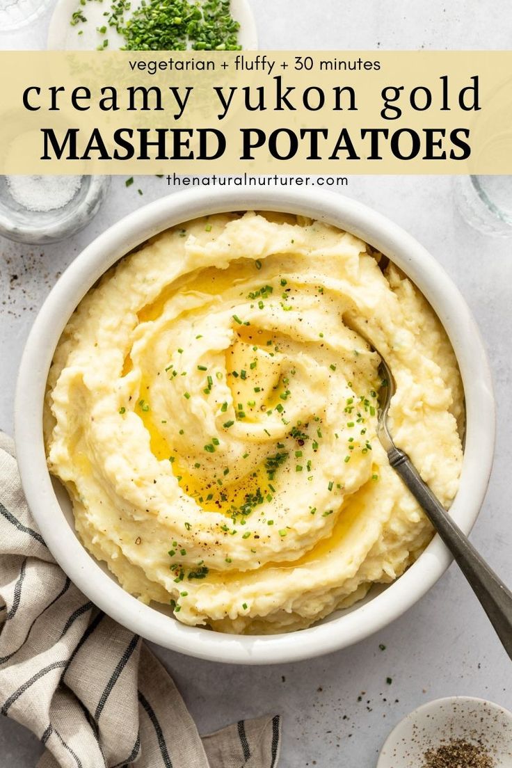 a bowl filled with mashed potatoes on top of a table