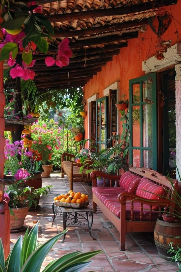 an outdoor patio with potted plants and flowers