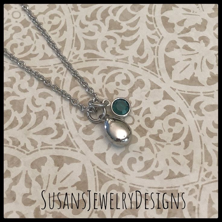 "This necklace is made with a tiny teardrop shaped stainless steel urn, a Swarovski crystal of your choice, and strung on a stainless steel chain. Flower urn has a drop of just under 3/4\" including jump rings at the top. Use the Options Pull Down menu to select your crystal and chain preferences. PLEASE NOTE: May - dk green and Dec. - turquoise has a style substitution due to Swarovski ceasing production of most of their crystals, including channel styles previously used in this listing. I no l Personalized Teardrop Keepsake Jewelry, Personalized Teardrop Birthstone Necklace For Anniversary, Personalized Teardrop Pendant Keepsake Jewelry, Silver Teardrop Birthstone Necklace, Hypoallergenic Stainless Steel Jewelry For Memorial, Silver Teardrop Birthstone Charm Necklace, Flower Urn, Urn Necklace, Baby Mom