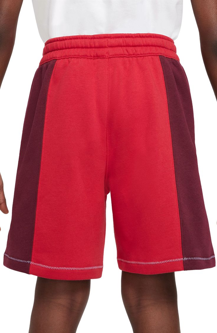 Comfort and style balance out in these kid-approved cotton-blend shorts fashioned with a drawstring waist and stand-out logo stitching. 80% cotton, 20% polyester Machine wash, tumble dry Imported Nike Cotton Activewear With Built-in Shorts, Athleisure Color Block Cotton Bottoms, Sporty Cotton Color Block Bottoms, Sporty Color Block Cotton Bottoms, Nike Red Sporty Shorts, Sporty Red Cotton Athletic Shorts, Red Cotton Sporty Athletic Shorts, Nike Cotton Sports Shorts, Nike Cotton Activewear With Elastic Waistband