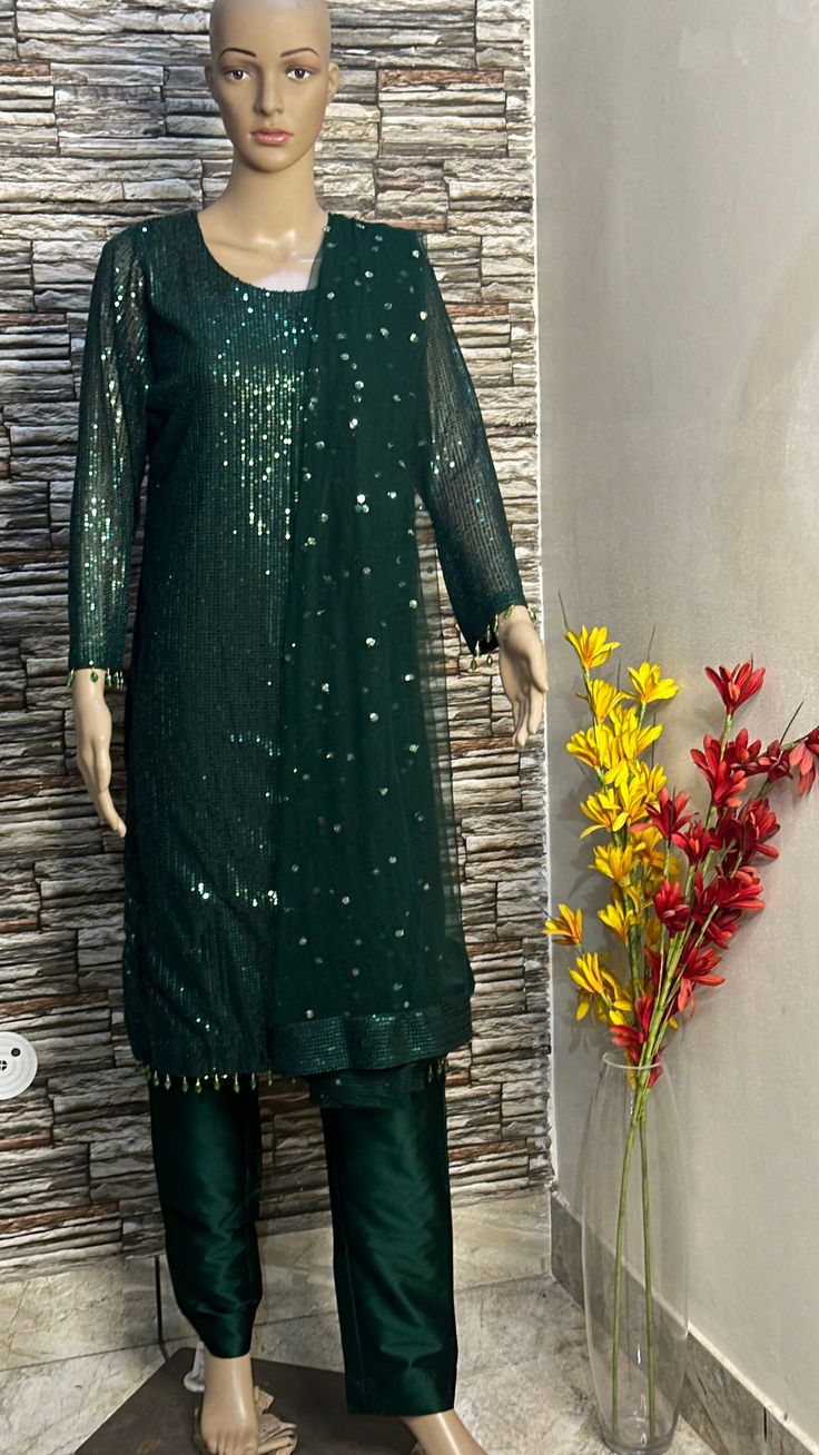 This green sequin straight kurta is made from designer sequin fabric which is eye catching in its look. This is kurta plazzo set .it is paired up with silk plazzo . Both the kurta and pants will have lining inside. We will collect your measurements as soon as the outfit is booked. Please feel free to contact us on etsy convo for further queries. Thank you Semi-stitched Sequin Straight Kurta, Designer Sequined Straight Kurta, Semi-stitched Straight Kurta With Sequins, Anarkali Kurta With Sequins, Semi-stitched Sequined Anarkali Set With Straight Kurta, Designer Pista Green Sequin Dress, Sequin Straight Kurta Salwar Kameez For Festivals, Sequin Embellished Straight Kurta Salwar Kameez For Festivals, Festive Straight Kurta Salwar Kameez With Sequins