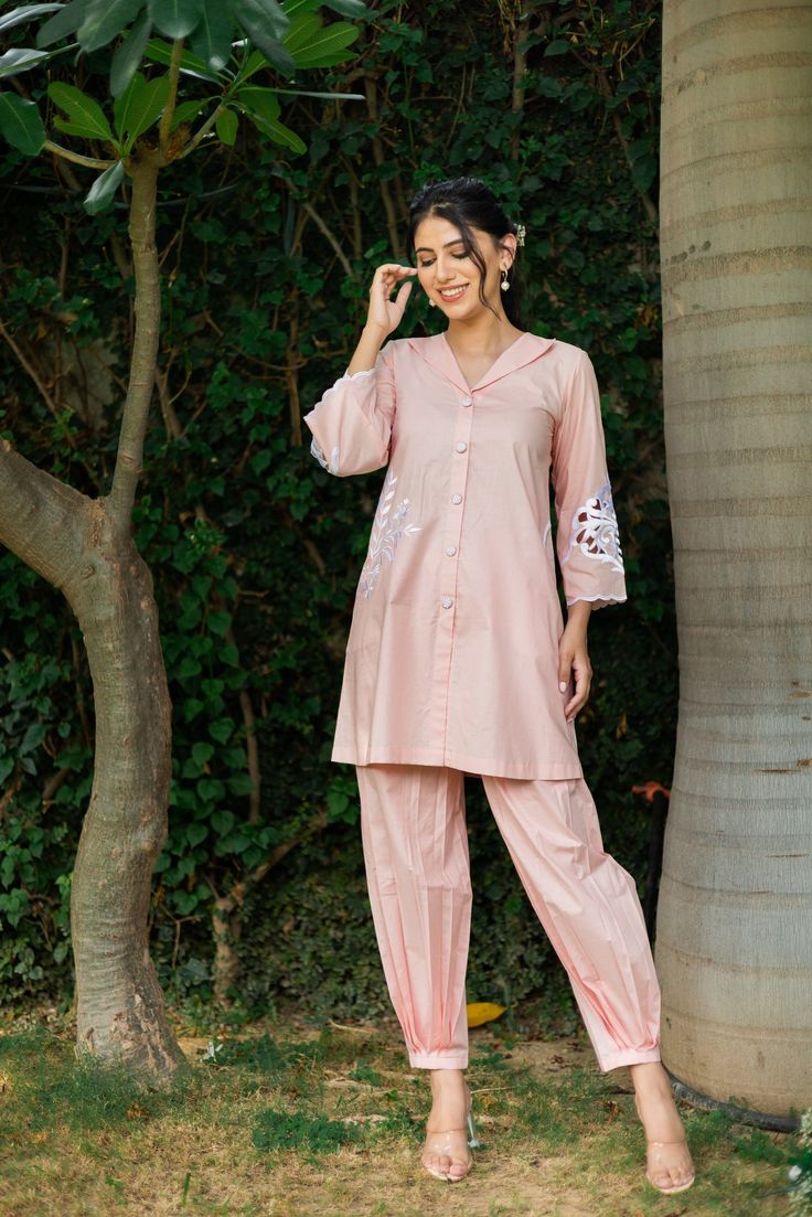 PRODUCT DETAIL: This co-ord set is perfect for any semi-formal and formal occasion. It looks trendy and smart for all age groups. The sleeves have a bold cutwork motif. The shirt is highlighted by circular side pockets and a thread embroidery motif on one side. It is a must-have in your wardrobe!  *The length of the to Festive Embroidered Workwear Pant Set, Festive Embroidered Pant Set For Work, Traditional Resham Embroidery Pant Set For Work, Workwear Sets With Embroidered Long Sleeves, Festive Floral Embroidered Sets For Workwear, Resham Embroidery Pant Set For Workwear, Traditional Spring Workwear Sets, Embroidered Long Sleeve Pant Set For Work, Eid Workwear Kurta With Chikankari Embroidery