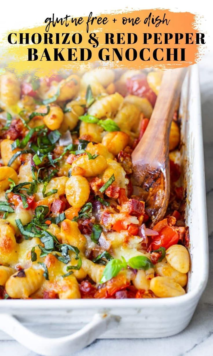 a casserole dish filled with baked gnocchini and spinach