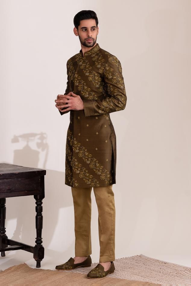 Olive green sherwani featuring long sleeves and a mandarin collar, adorned with flora vine garden embroidery and sequin highlights. Paired with a beige straight pant for a complete look., Fit: Relaxed Designer Unstitched Straight Kurta, Designer Long Sleeve Traditional Wear For Festive Season, Designer Ceremonial Sherwani With Long Sleeves, Designer Straight Kurta For Eid, Designer Long Sleeve Sherwani For Ceremonial Occasions, Designer Straight Kurta For Ceremonial Occasions, Long Sleeve Lawn Suit With Zari Work, Designer Traditional Wear With Zari Work And Long Sleeves, Designer Long Sleeve Traditional Wear With Zari Work