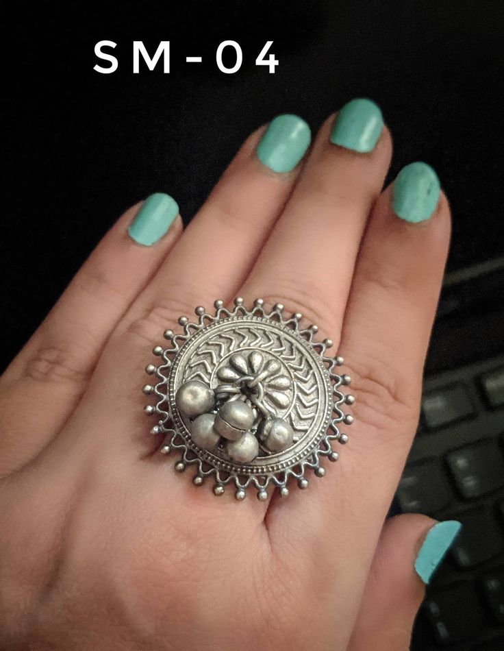 Add a hint of flamboyance to your outfit with these intricately designed and handcrafted rings in antique silver look .Rings are adjustable so can fit any size comfortably SM-01 & SM-02 diameter 2 inches Weight 15 GM's approx SM-03 ,SM-04 ,SM-05 ,SM-06 ,SM-07 Diameter 1 inches Weight 10 GM's approx Note: All in stock items will be shipped from New Delhi, India within 2-3 business days after receipt of payment. International orders may take anytime between 3 to 5weeks for your shipments to re Traditional Indian Jewellery, New Delhi India, Kundan Earrings, Handcrafted Rings, German Silver, Delhi India, New Delhi, Adjustable Rings, Indian Jewelry