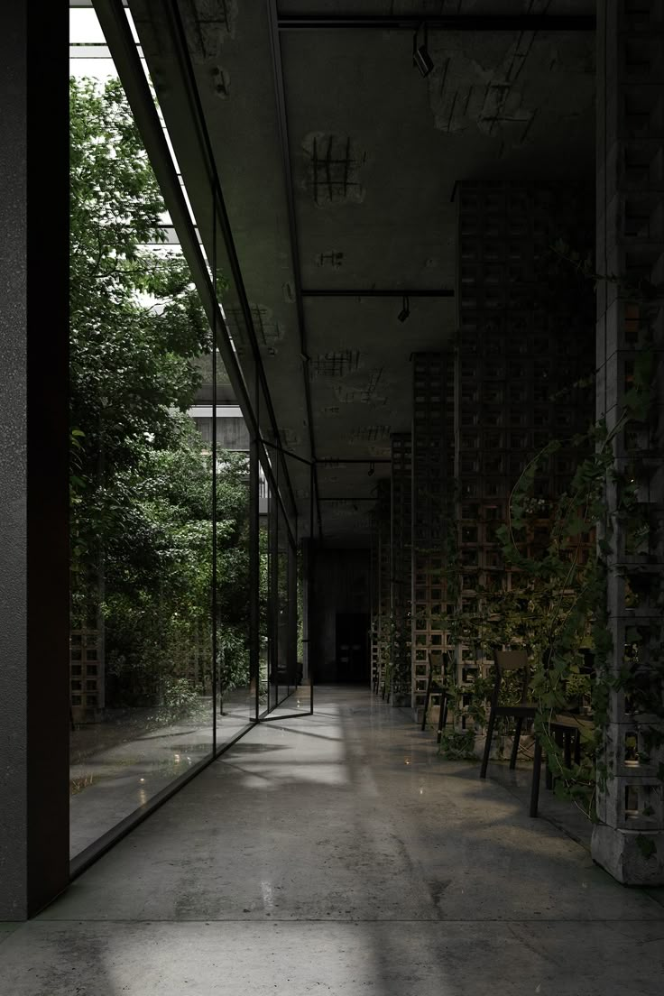 an empty room with benches and trees in the background