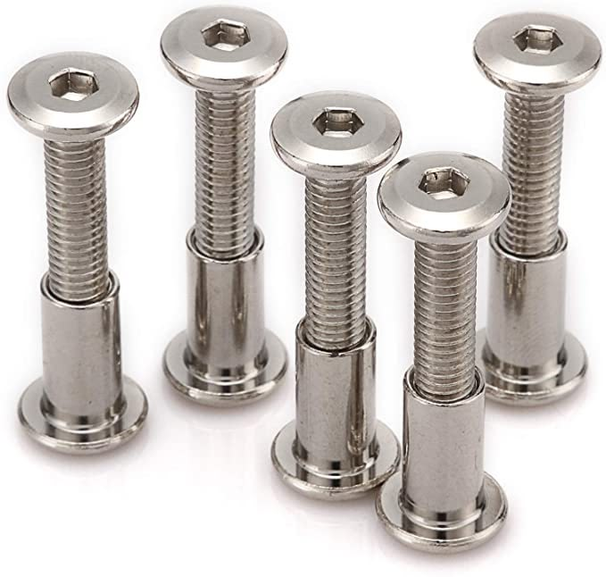 six stainless steel screws and nuts on a white background