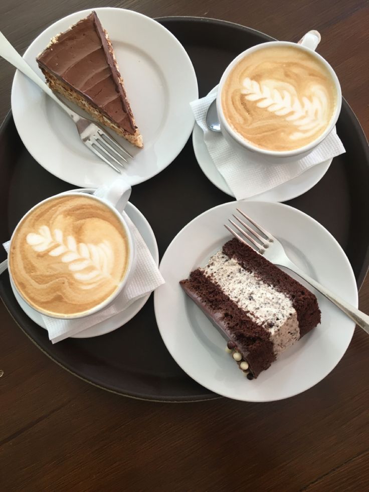 three plates with cakes and two cups of coffee