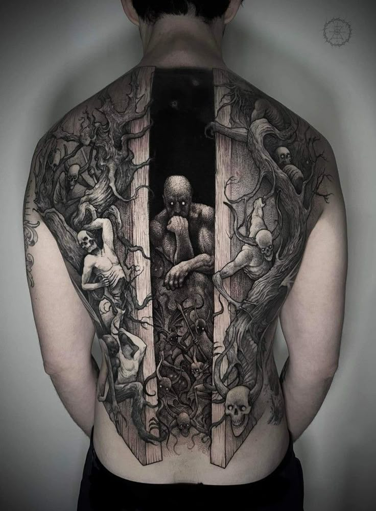 the back of a man's body with tattoos on it and an open door