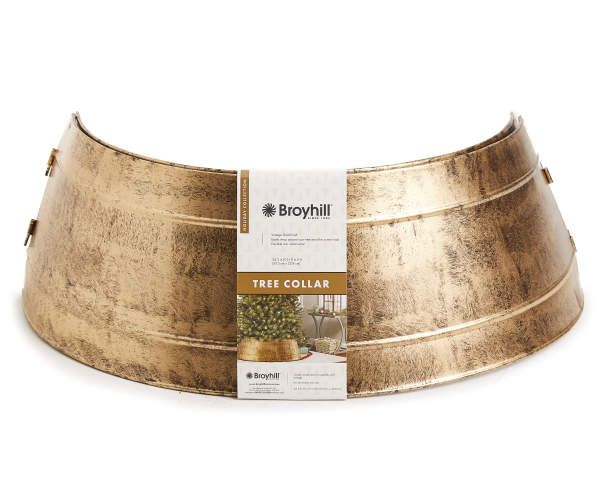 a large metal bowl with gold trimmings on the sides and a label for brolyhill tree collar