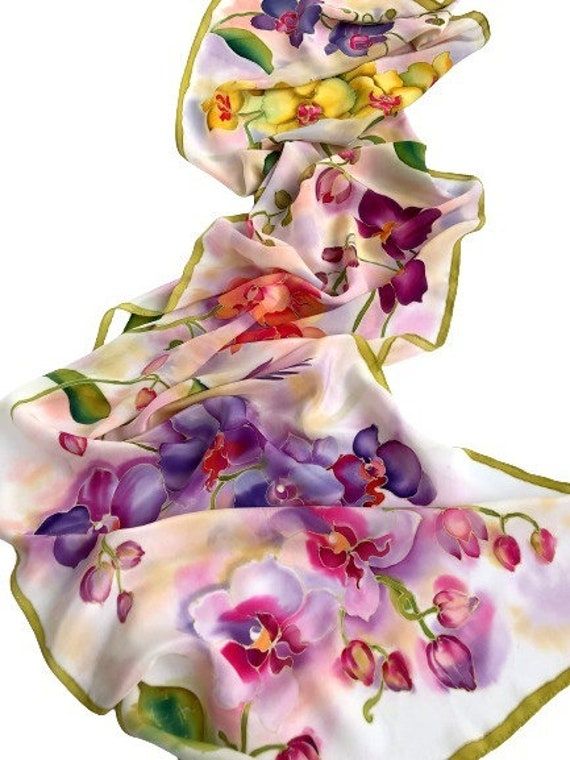 hand-painted silk scarf, womens birthday gifts, evening shawl, orchid silk scarf, women silk scarf, designer silk scarf, floral evening shawl, PAINTED silk scarf, hand-painted silk, BATIK silk scarf Made to order. A white, light, festive scarf on soft and delicate silk will surely draw attention to its owner and cheer up. A scarf made of natural silk is a stylish accessory and a unique gift for yourself or your loved ones! Size 180 cm by 45 cm,  70 ′ * 17 ′. Hand-sewn with silk threads. All my scarves are painted with attention to detail and composition, and each scarf is signed. The scarf drapes perfectly and will be soft and pleasant to your skin. Natural silk is an excellent thermoregulator, so it can be worn at any time of the year: in winter it will warm and protect from the wind, and Womens Birthday Gifts, Painting Orchids, Designer Silk Scarf, Womens Birthday, Small Silk Scarf, Painting On Fabric, Designer Silk Scarves, Evening Accessories, Hand Painted Scarves