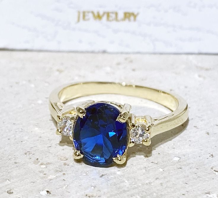 Don't miss this opportunity to own this beautiful gemstone ring crafted in 14k gold filled => Gemstone Type - Corundum Sapphire, Clear Quartz => Gemstone Cut - Faceted => Gemstone Size - 8*10 mm, 3 mm => Total Number of Gemstones - 3 => Metal Type - 14k Gold Filled (Tarnish Resistant And Nickel Free) - also available in 925 sterling silver * Please contact me for pricing on a sizes larger than 11 * ~ Feel free to ask me about custom made designs. ❏ Replacements and custom orders : Adjustable Oval Rings With Gemstone Accents, Oval Vs Clarity Birthstone Promise Ring, Gold Sapphire Ring With Gemstone Accents For Promise, Gold Oval Crystal Ring With Center Stone, Gold Oval Crystal Promise Ring, Adjustable Oval Gold Birthstone Ring, Gold Oval Crystal Birthstone Ring, Oval Birthstone Ring With Vs Clarity In 14k Gold, Oval Sapphire Ring With Vs Clarity For Gift