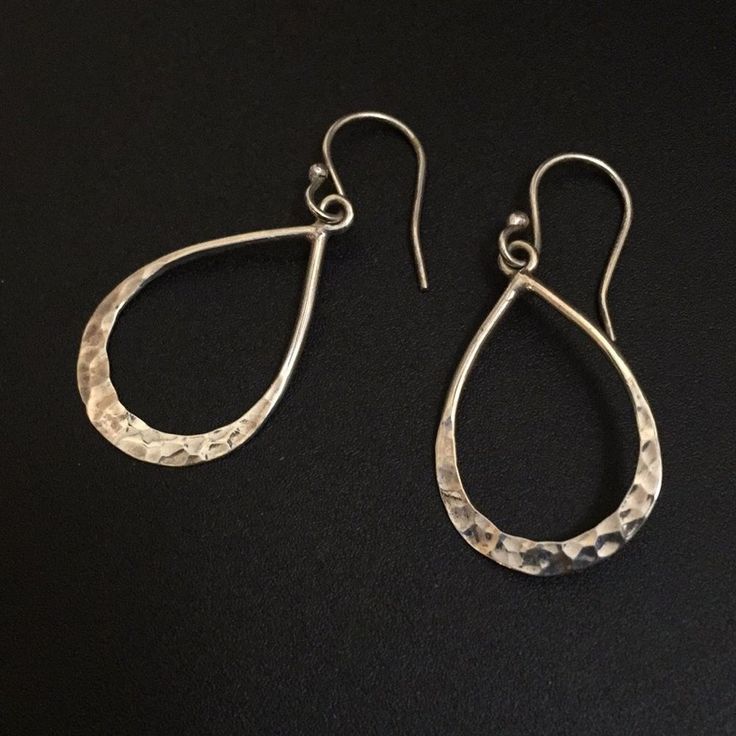 Simple, Lightly Hammered Design Dangle Earrings Sterling Silver With 9.25 / 925 Stamp Sterling Silver Fishhook Wires Tear Drop / Droplet Shape Approximately 1.2” Long Droplet, 1.65” Full Length ... And 7/10” Inch (2-Ish Mm) At Widest Point, Roughly 1-1.5mm Depth My Dad Got Me These In New Mexico, Artisan Made, Fancy, I Think Indigenous / Native American Made I’ve Never Worn Them Except To Take These Pictures, Hence Selling 925 Ss Lightly Hammered Earrings Remember I Make $76 On A $95 Sale Everyday Sterling Silver Long Drop Jewelry, Classic Sterling Silver Teardrop Hoop Earrings, Classic Teardrop Sterling Silver Hoop Earrings, Elegant Hammered Sterling Silver Hoop Earrings, Classic Sterling Silver Pierced Teardrop Earrings, Elegant Hammered Dangle Teardrop Earrings, Elegant Hammered Teardrop Dangle Earrings, Silver Long Drop Hammered Jewelry, Classic Sterling Silver Dangle Earrings