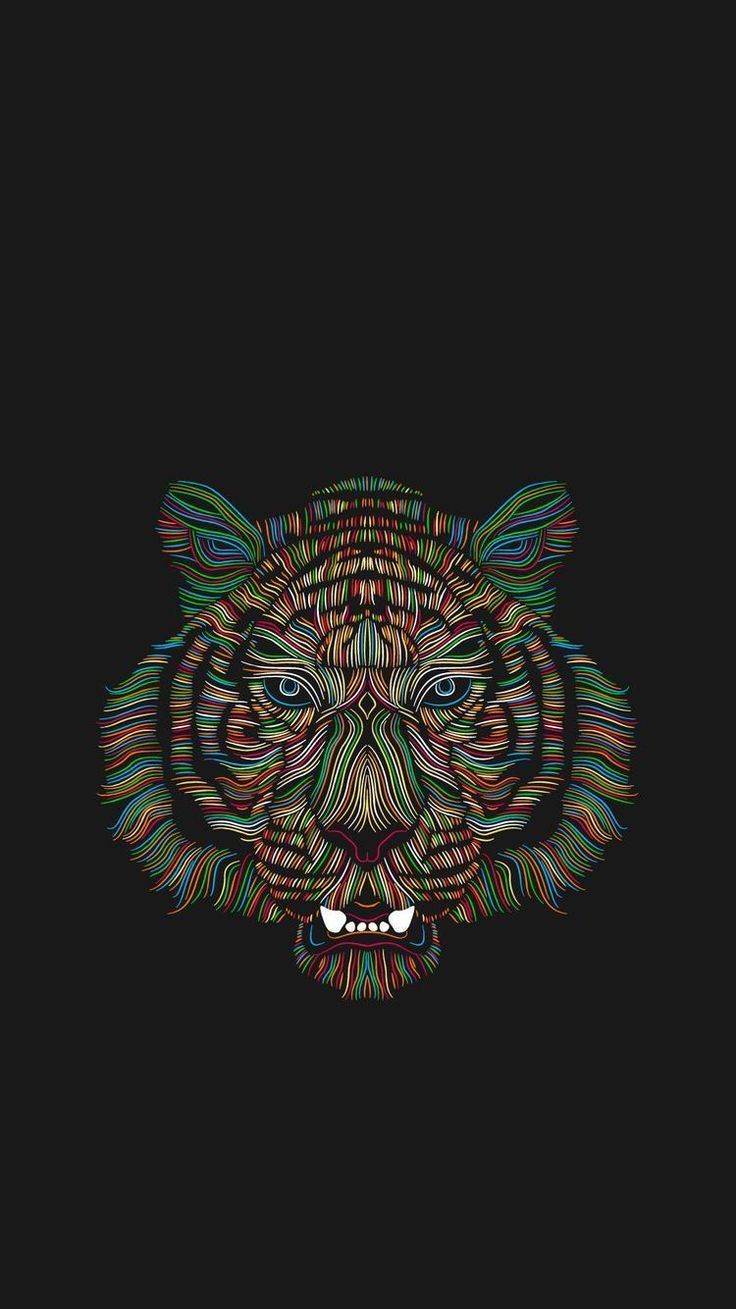 a colorful tiger's face on a black background