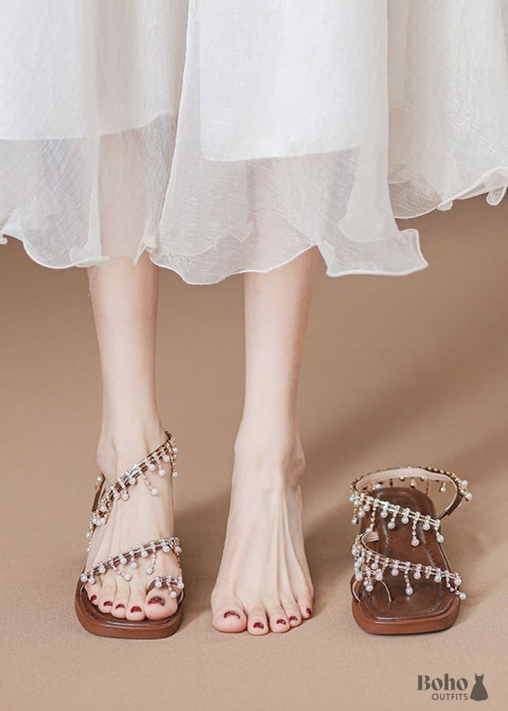 Introducing Our Summer Staple: Boho Summer High Heel Sandals Pearl Embellishments: Adding a touch of luxury to the boho vibe, our pearl sandals feature delicate pearl embellishments that shimmer in the sunlight. Each pearl is carefully placed to create a stunning visual effect, making these sandals a true work of art. Crafted with care and attention to detail, these boho sandals are designed to add a touch of glamour to any outfit, making them a must-have addition to your shoe collection. Upper Material: MicrofiberToe Shape: Round ToeOutsole Material: RubberLining Material: Microfiber Pearl Embellished Open Toe Sandals For Party, Evening Pearl Embellished Sandals For Spring, Spring Beaded Sandals With Flat Heel, Spring Beaded Flat Sandals, Open Toe Rhinestone Festival Sandals, Festival Rhinestone Open Toe Sandals, Rhinestones Open Toe Festival Sandals, Pearl Sandals For Summer Party, Embellished Sandals For Wedding In Spring