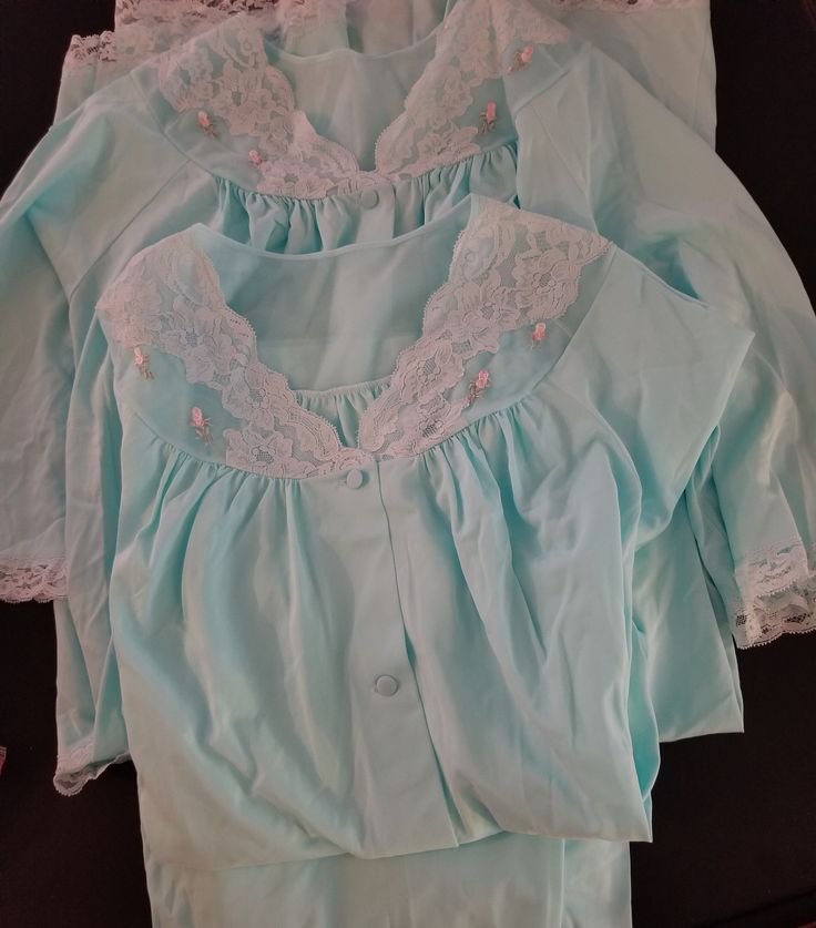 Lovely pajama and robe matching set in light blue with Chantilly lace, rose appliques and pockets on top and robe. Wake up in the mornings in this set of  PJ's and robe or in the evening as a lounge set.  Size: Medium Set: Shirt and Pants & Robe Material: Nylon Condition: Overall very good vintage condition.  Vintage linens are at least 20-50 years old and therefore; some items may have a few minor imperfections.  If you have any questions about this item, please let me know and I will do my bes Cotton Sleep Sets With Lace Trim, Light Blue Cotton Sleepwear For Home, Light Blue Cotton Sleepwear, Long Sleeve Sleepwear With Lace Trim For Pajama Party, Long Sleeve Lace Trim Sleepwear For Sleepovers, Long Sleeve Lace Trim Sleepwear, Long Sleeve Lace Trim Sets For Wedding Night, Cotton Loungewear Sets With Lace Trim, Long Sleeve Sleepwear With Lace Trim For Loungewear