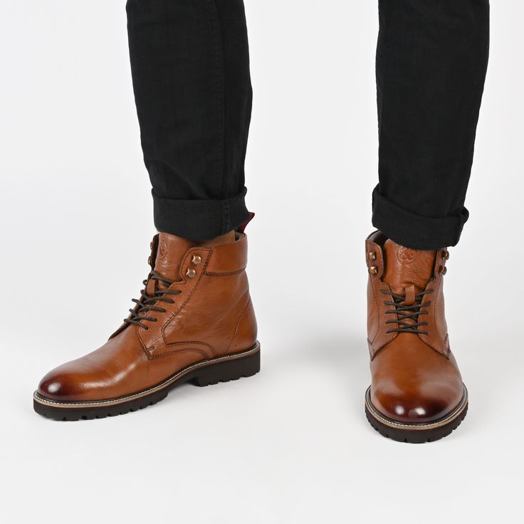 Meet the Simeon boot from Thomas & Vine – a versatile wardrobe essential designed for both style and comfort. Crafted from genuine leather, these lace-up boots effortlessly elevate any outfit, whether you're dressing up with button-ups or keeping it casual with vintage band tees. Featuring a round-toe silhouette, cushioned collar, 6 mm Tru Comfort Foam™ footbed, and a 1 1/4-inch block heel, these boots offer a perfect blend of fashion and support for every occasion. • Round-Toe • Lace-Up • Cushi Mens Leather Ankle Boots, Thomas Vines, Vintage Band Tees, Versatile Wardrobe, Vintage Band, Stylish Shoes, Dr. Martens Boots, Band Tees, Black Ankle Boots