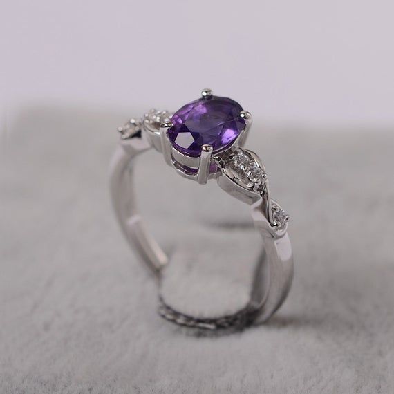 ~~~~~~~~~~~~~~~~Ring details~~~~~~~~~~~~~~~~metal: silver/14k white(rose/yellow) goldcenter stone: Oval shape 6x8mm (1.16ct) amethystaccent stone: CZNOTE: if it is silver or white gold, it will be get plated with rhodium~~~~~~~~~~~~~~~~Customization is available~~~~~~~~~~~~~~~~you can change, add or remove any parts of the ring if you have good idea. I can add special engraving inside the shank of the ring by free (words, date, simply simbles and so on) too. I am happy to help out or make any ad Weding Rings, September Birthstone Rings, Gold Anniversary Rings, Engagement Ring Ideas, Silver Engagement Ring, Natural Gemstone Ring, Silver Anniversary, Engagement Ring For Women, Magical Jewelry