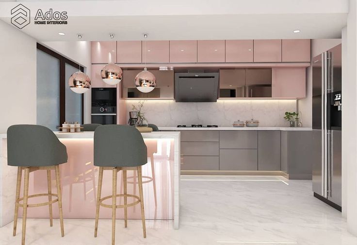 an image of a modern kitchen setting with bar stools and pink countertop in the center