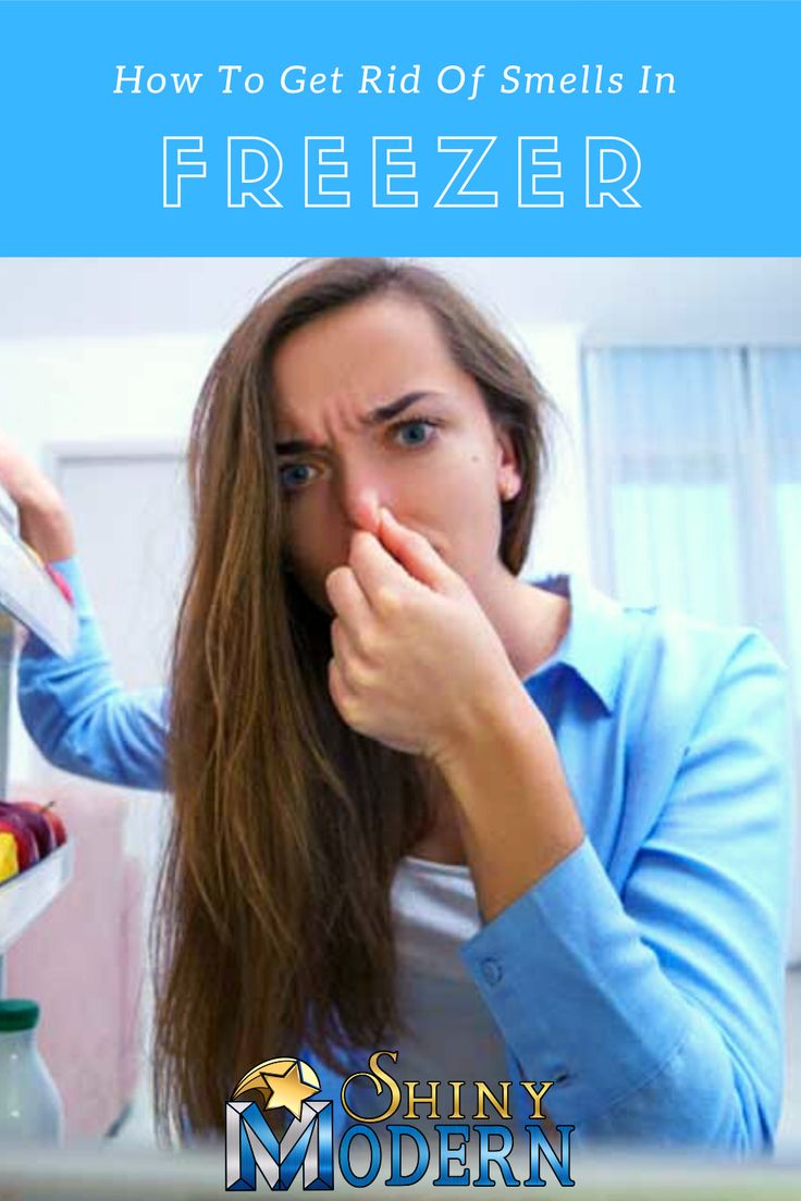 a woman holding a blender in front of her face with the words how to get rid of smells in freezer